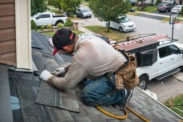 Professional Roof Replacement technician working in Fall River, WI